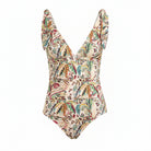A one-piece swimsuit with a ruffled sweetheart neckline and a multicolor paisley print on a light beige background, shown against a solid gray background.